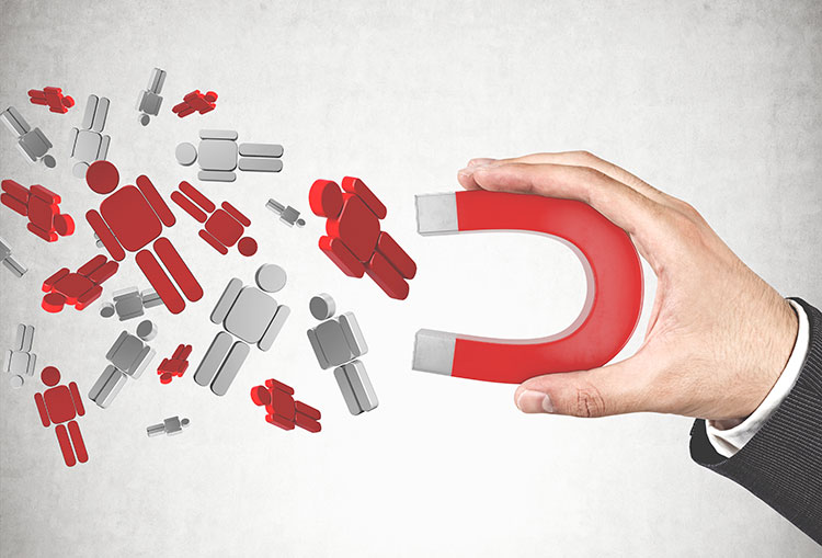 a hand with magnet attracting new leads